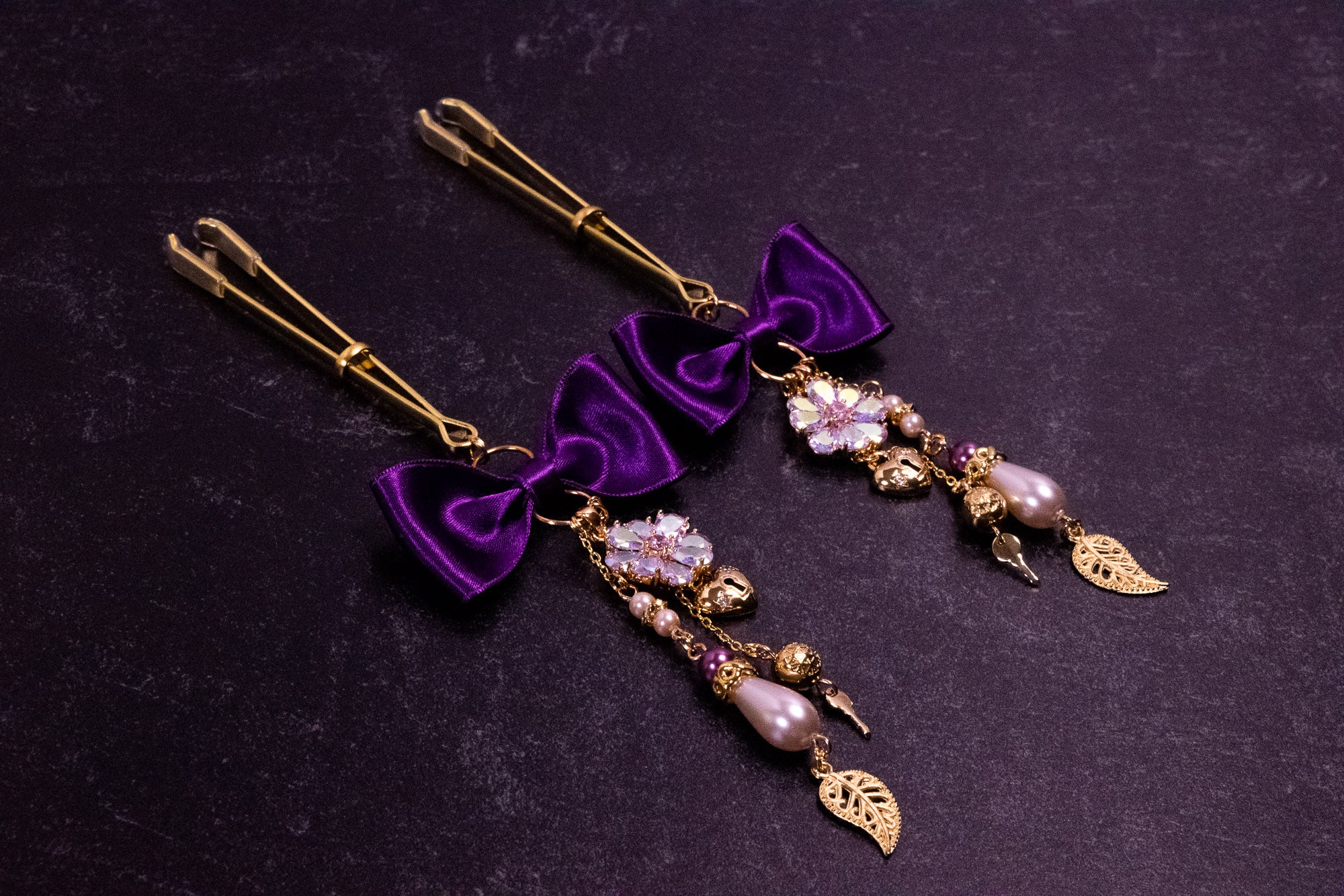 Deluxe Imperial Purple Bow Tweezer Nipple Clamps in Gold